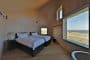 Dune-House-casa-cubiertas-inclinada-vidrio-planta-baja, foto dormitorio