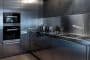 Cocina en acero inoxidable, por Buratti Architects
