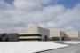 Museo universitario en Pensilvania con arquitectura de piedra arenisca y volúmenes escalonados.